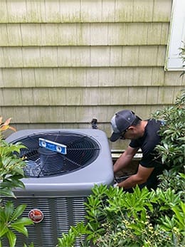 Technician Repairing AC