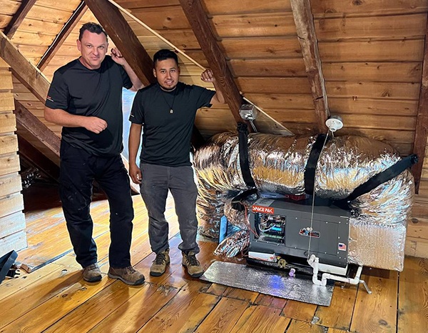 two workers with new furnace